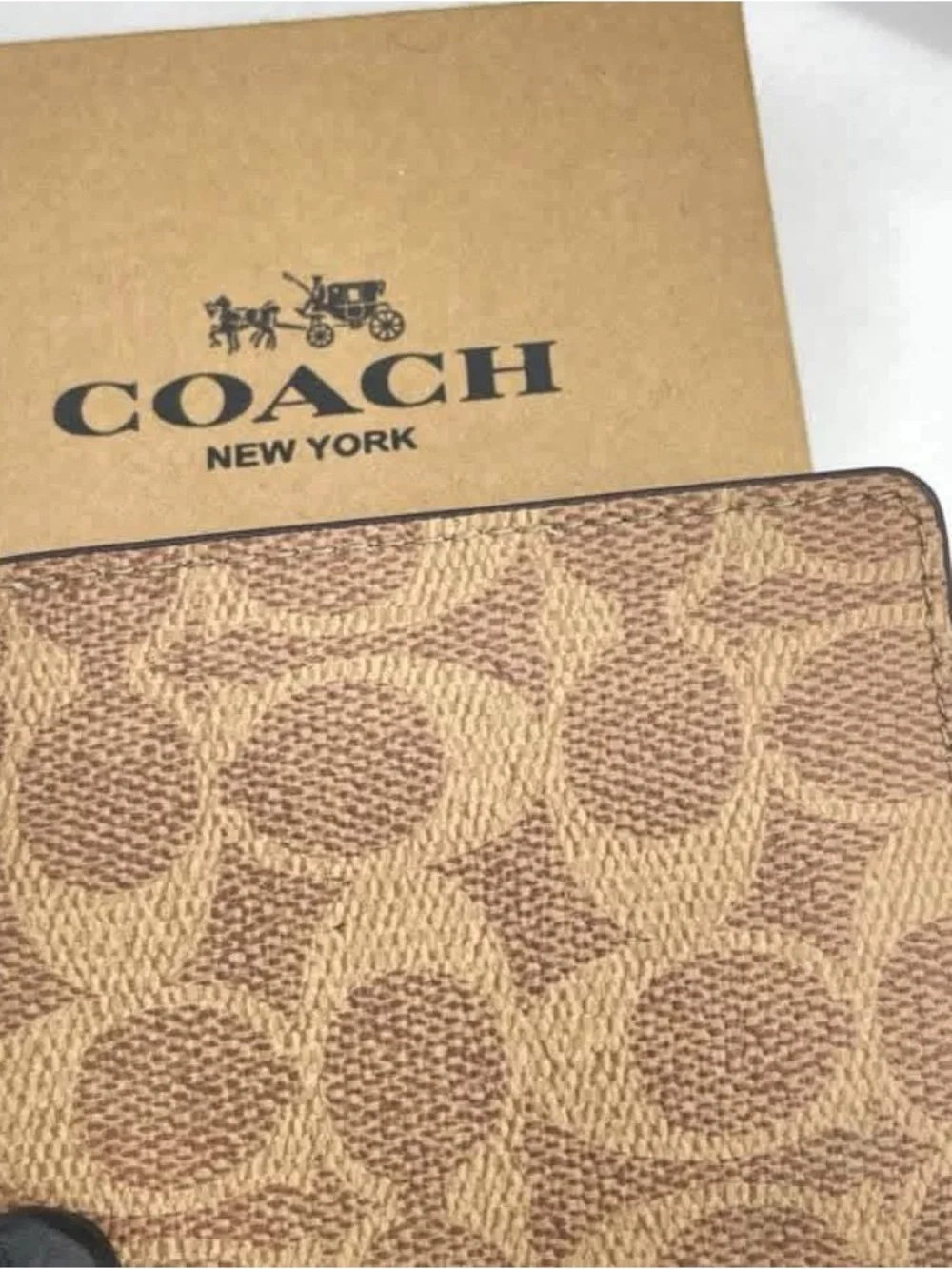 Coach Bifold Card Holders in Black, Brown, and Cream
